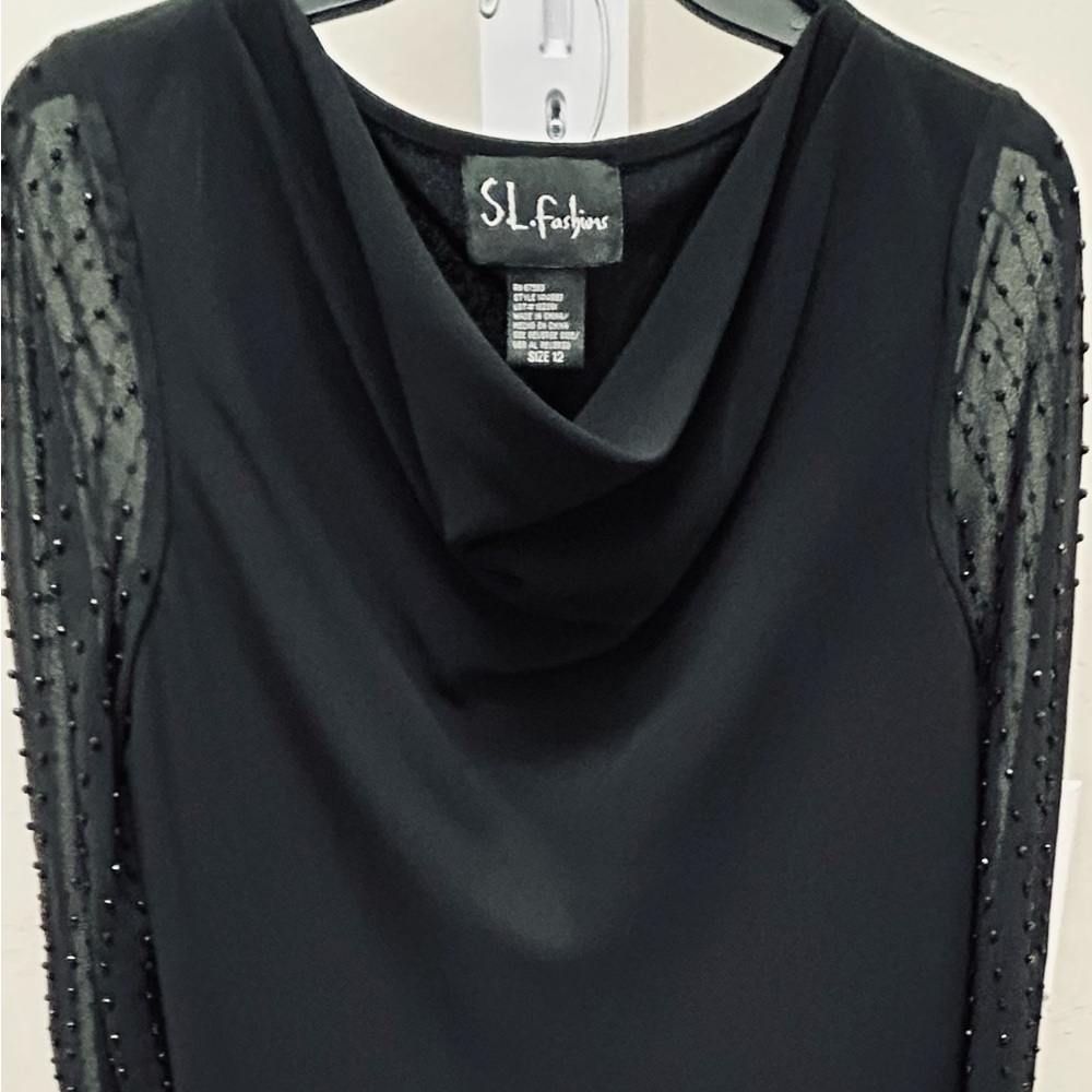 2 Piece Black/Beaded sleeve top. Long elastic waist pull on skirt. Size 12.